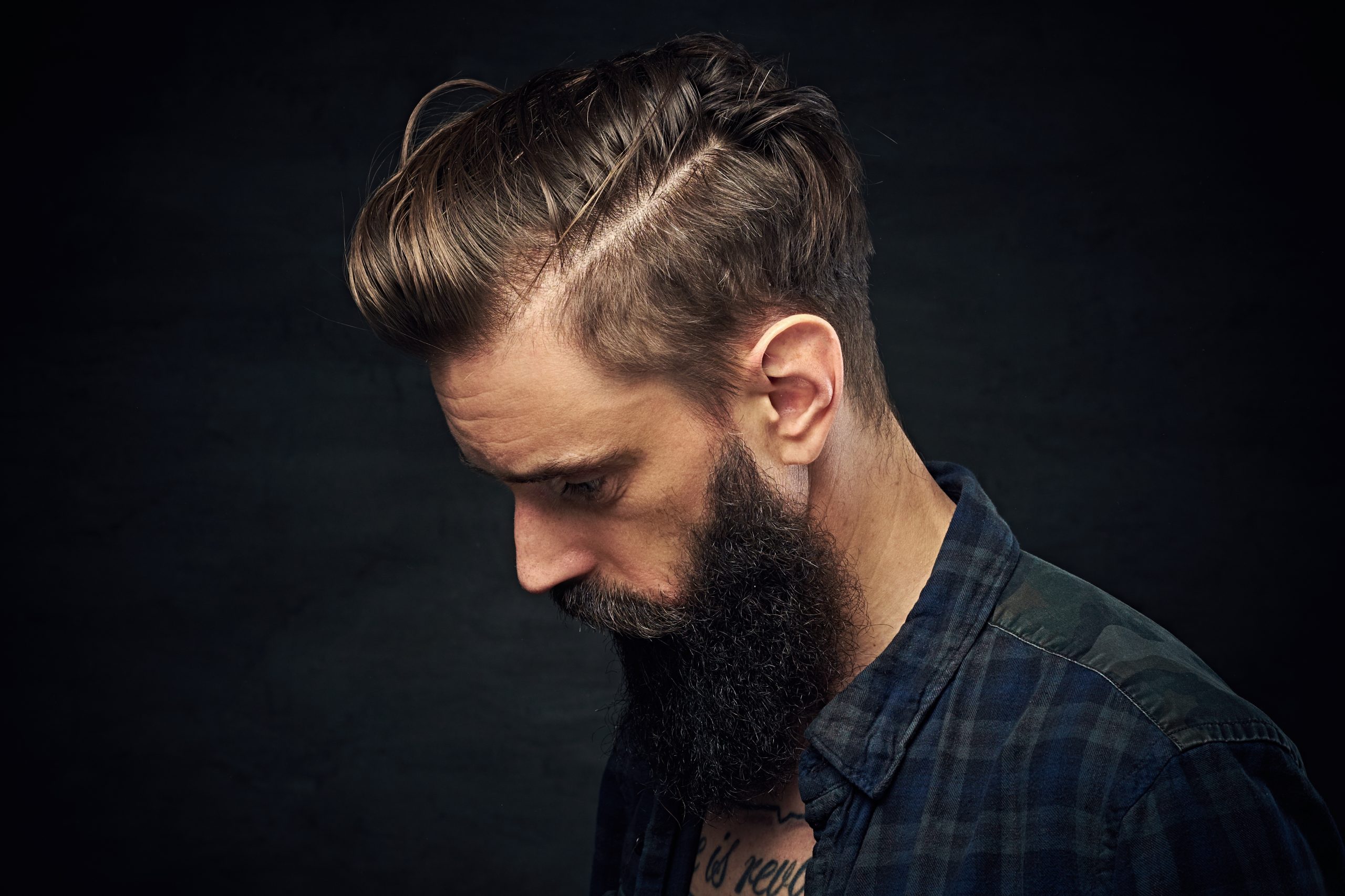Portrait of bearded male with long hair.