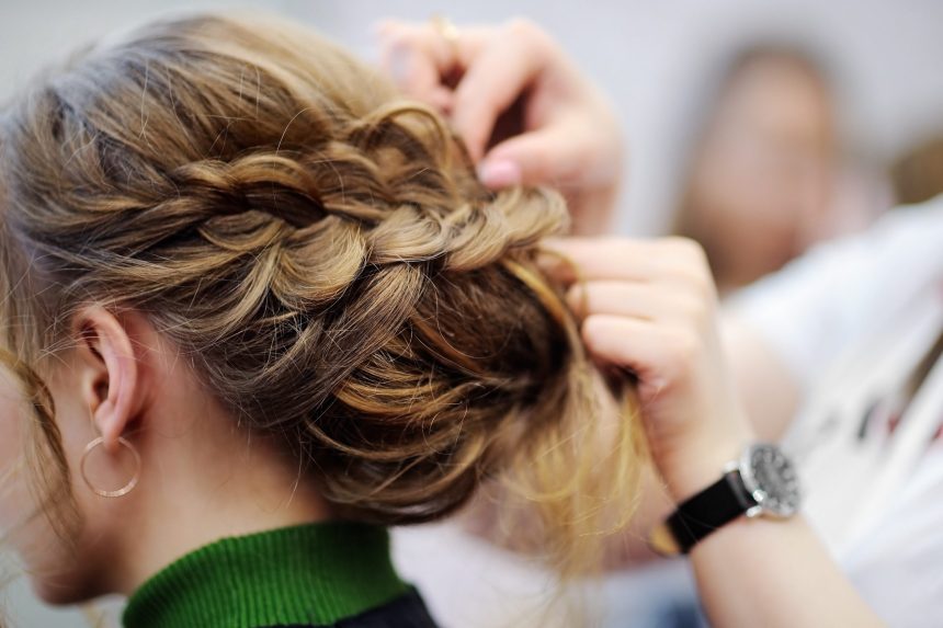 Young woman/bride getting her hair done before wedding or party